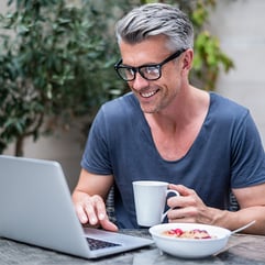 man happy on laptop